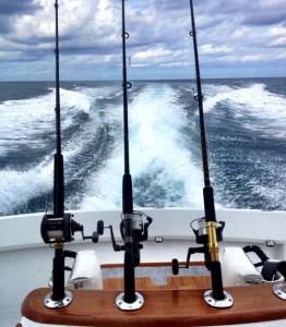 photo of a boat and deep sea fishing rods - hired power breakaway adventure learning