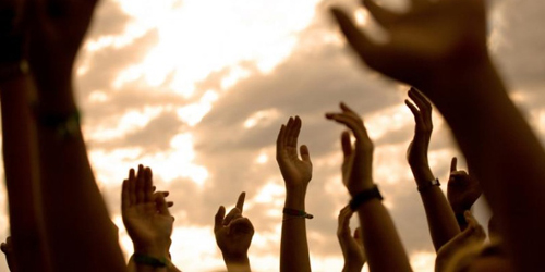 photo of hands in the air - hired power breakaway - our philosophy