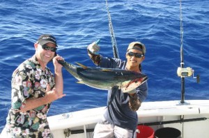 photo of two young men deep sea fishing - hired power breakaway adventure learning