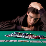 Image of young man gambling on cards - process addictions facts