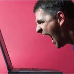 photo of a young man yelling at his laptop - anger management in recovery - breakaway hired power