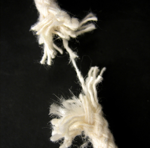 photo of a piece of rope being stressed and pulled almost to the point of breaking - distress tolerance skills - hired power breakaway