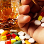 photo of multi-colored pills and a glass of alcohol - breakaway hired power - inpatient and outpatient drug alcohol detox