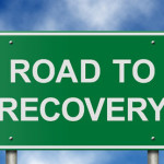 photo of a street sign that says Road to Recovery - breakaway hired power - long term addiction treatment