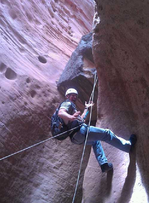photo of a young man repelling down a cave in southern california - breakaway drug rehab adventure learning - hired power breakaway transitional living for young adult men