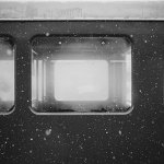 black and white photo from the outside looking through windows on a subway train - judgment - breakaway young men's transitional program in costa mesa