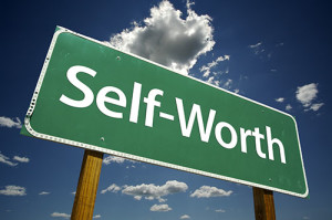 photo of a sign reading self-worth - building self worth in recovery - hired power breakaway