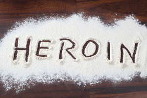 Image of heroin with name spelled in it - heroin use facts