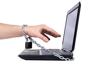 Image of a young man's arm chained to a laptop - Internet Addiction - hired power breakaway